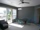 Relaxing Florida room with ceiling fan and sliding glass door at 314 Salt Marsh Ln, Groveland, FL 34736