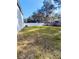 Large backyard with a white fence and grassy area at 33025 Jodee Ct, Leesburg, FL 34788