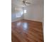 Well-lit bedroom featuring wood-look flooring and window at 33025 Jodee Ct, Leesburg, FL 34788