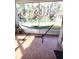 Screened patio with hammock and view of backyard at 33025 Jodee Ct, Leesburg, FL 34788