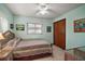 Cozy bedroom with a colorful bedspread and wicker furniture at 3450 Laurel Dr, Mount Dora, FL 32757