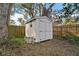 A sturdy storage shed provides ample space for tools and equipment at 3450 Laurel Dr, Mount Dora, FL 32757