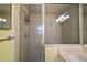 Shower with glass enclosure and tiled walls at 3450 Laurel Dr, Mount Dora, FL 32757