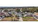 Wide shot of the house and surrounding neighborhood from above at 36628 Grand Island Oaks Cir, Grand Island, FL 32735