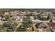 Aerial view of house and neighborhood, showcasing surrounding homes and landscape at 36628 Grand Island Oaks Cir, Grand Island, FL 32735