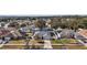 Aerial view of the house and neighborhood at 36628 Grand Island Oaks Cir, Grand Island, FL 32735