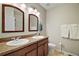 Bathroom with double vanity and a toilet at 36628 Grand Island Oaks Cir, Grand Island, FL 32735