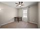 Small bedroom with a ceiling fan and small table at 36628 Grand Island Oaks Cir, Grand Island, FL 32735