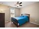 Bright bedroom with a double bed and ceiling fan at 36628 Grand Island Oaks Cir, Grand Island, FL 32735