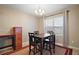 Bright dining room with four chairs and a wood table at 36628 Grand Island Oaks Cir, Grand Island, FL 32735