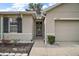 Front entrance of the house with walkway and landscaping at 36628 Grand Island Oaks Cir, Grand Island, FL 32735