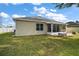 House exterior showcasing back of the home and patio at 36628 Grand Island Oaks Cir, Grand Island, FL 32735