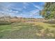 Peaceful backyard with a pond view and lush green grass at 370 Salt Marsh Ln, Groveland, FL 34736