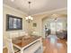 Dining room with hardwood floors and access to the living room at 370 Salt Marsh Ln, Groveland, FL 34736