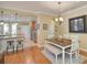 Bright dining area with a table and chairs near the kitchen at 370 Salt Marsh Ln, Groveland, FL 34736