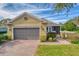 Beautiful one-story home with a two-car garage and well-manicured lawn at 370 Salt Marsh Ln, Groveland, FL 34736