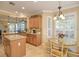 Kitchen with a breakfast nook and view into the living area at 370 Salt Marsh Ln, Groveland, FL 34736