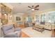 Comfortable living room with hardwood floors and a ceiling fan at 370 Salt Marsh Ln, Groveland, FL 34736