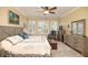 Spacious main bedroom with large windows and dresser at 370 Salt Marsh Ln, Groveland, FL 34736