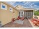 Relaxing patio with brick flooring, lounge chairs, and a picnic table at 370 Salt Marsh Ln, Groveland, FL 34736