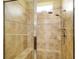 Large walk-in shower with tiled walls and seat at 370 Salt Marsh Ln, Groveland, FL 34736