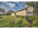 Landscaped side yard with a lush lawn and neatly trimmed hedges at 370 Salt Marsh Ln, Groveland, FL 34736