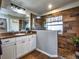 Modern bathroom with a walk-in shower and wood-like tile at 37146 Calhoun Rd, Eustis, FL 32736