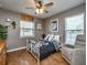 Cozy bedroom with a metal bed frame and window seating at 37146 Calhoun Rd, Eustis, FL 32736