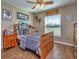 Cozy bedroom with wood flooring and a full-size bed at 37146 Calhoun Rd, Eustis, FL 32736