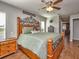 Main bedroom with a large bed and ensuite bathroom access at 37146 Calhoun Rd, Eustis, FL 32736