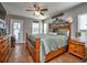 Spacious main bedroom with wood bed frame and backyard access at 37146 Calhoun Rd, Eustis, FL 32736