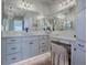 Vanity area with a large mirror and plenty of counter space at 3735 Conservation Trl, The Villages, FL 32163