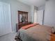 Bright bedroom with a double bed and plenty of closet space at 3735 Conservation Trl, The Villages, FL 32163