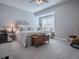 Serene bedroom with plush bedding and ample natural light at 3735 Conservation Trl, The Villages, FL 32163