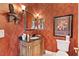 Elegant bathroom with granite vanity, soaking tub, and decorative wallpaper at 39248 Tacoma Dr, Lady Lake, FL 32159