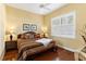 Large bedroom with hardwood floors and plantation shutters at 39248 Tacoma Dr, Lady Lake, FL 32159