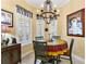 Charming breakfast nook with painted table and chairs at 39248 Tacoma Dr, Lady Lake, FL 32159