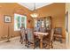 Formal dining room with a large table, buffet, and warm-toned walls at 39248 Tacoma Dr, Lady Lake, FL 32159