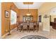 Formal dining room with a large table, buffet, and warm-toned walls at 39248 Tacoma Dr, Lady Lake, FL 32159