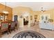 Bright dining room with large windows and hardwood floors at 39248 Tacoma Dr, Lady Lake, FL 32159