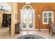 Elegant entryway with double doors and a view into the home office at 39248 Tacoma Dr, Lady Lake, FL 32159