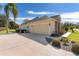 House exterior showcasing garage and landscaping at 39248 Tacoma Dr, Lady Lake, FL 32159