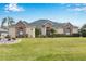 Single-Gathering home with stone accents, manicured lawn, and palm trees at 39248 Tacoma Dr, Lady Lake, FL 32159