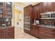 Kitchen with double wall ovens and laundry access at 39248 Tacoma Dr, Lady Lake, FL 32159