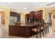 Kitchen island with seating and granite countertops at 39248 Tacoma Dr, Lady Lake, FL 32159