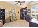 Home office with built-in shelving, desk, and comfortable chair at 39248 Tacoma Dr, Lady Lake, FL 32159