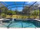 Enjoy this refreshing screened-in pool and spa at 39248 Tacoma Dr, Lady Lake, FL 32159