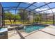 Enjoy this refreshing screened pool and spa area at 39248 Tacoma Dr, Lady Lake, FL 32159