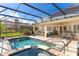 Inviting pool and spa with screened enclosure, perfect for relaxation at 39248 Tacoma Dr, Lady Lake, FL 32159