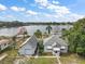 Aerial view of house, garage and lakefront lot at 39645 Turek Ln, Umatilla, FL 32784